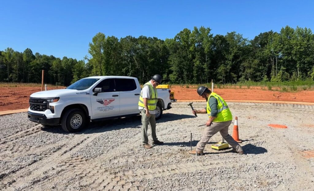 Eagle Engineering field crew working at a job site next to a company truck